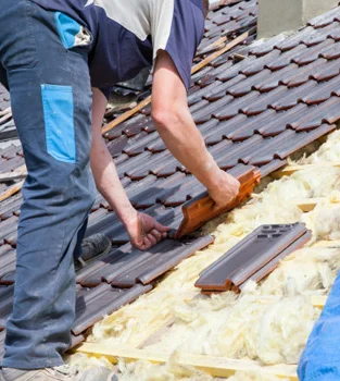 Roofing professional installing roof materials